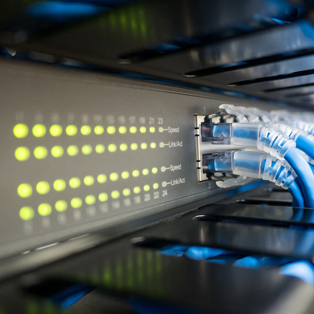 Network switch and ethernet cable in rack cabinet. Network connection technology and has a status LED to show working status. Concept of infrastructure with cables connected to data center