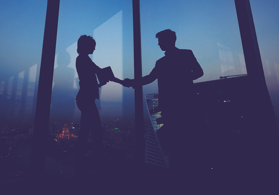 Silhouette,Of,Businessman,Shaking,Hands,In,Honor,Of,The,Transaction